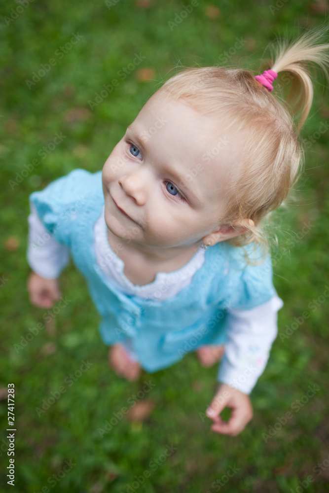 cute little girl outdoors in a park cute little girl outdoors in a park