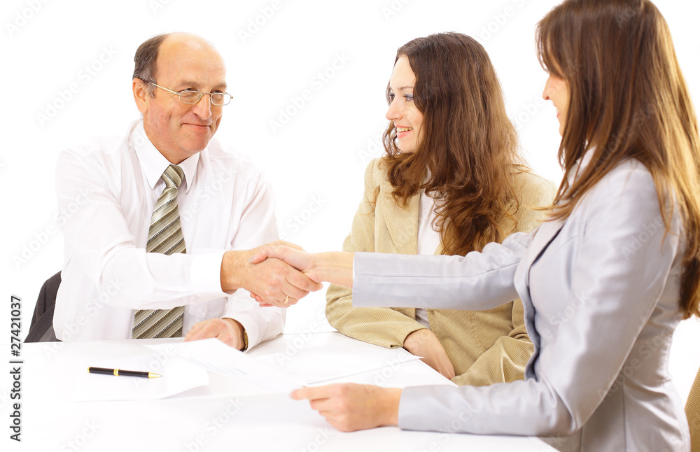 Business people shaking hands, finishing up a meeting Business people shaking hands, finishing up a meeting