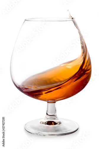 Cognac splashes in a glass