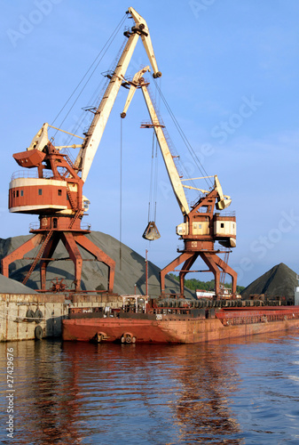 Two dock clamshell crane and barge