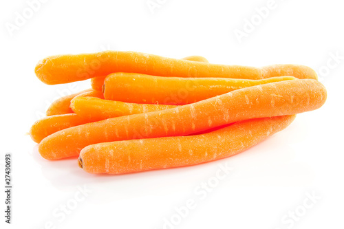 pile of fresh carrots over white background
