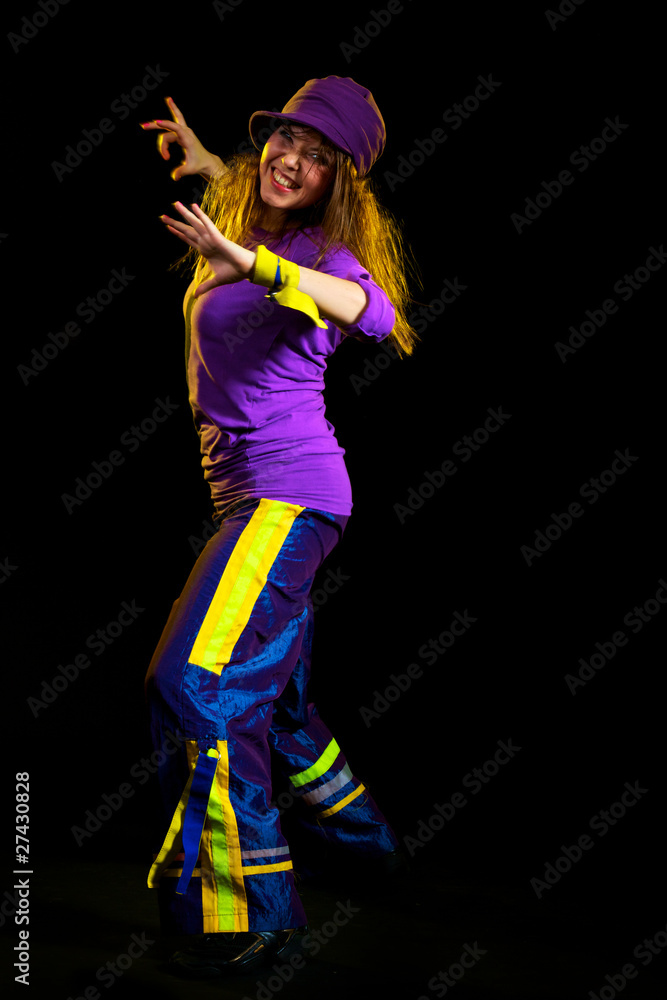 Obraz premium young female dancing on the black background