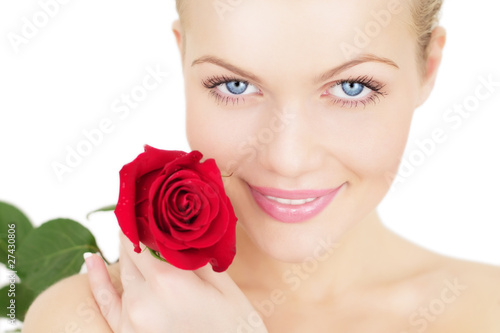 Beautiful girl with a red rose on white background