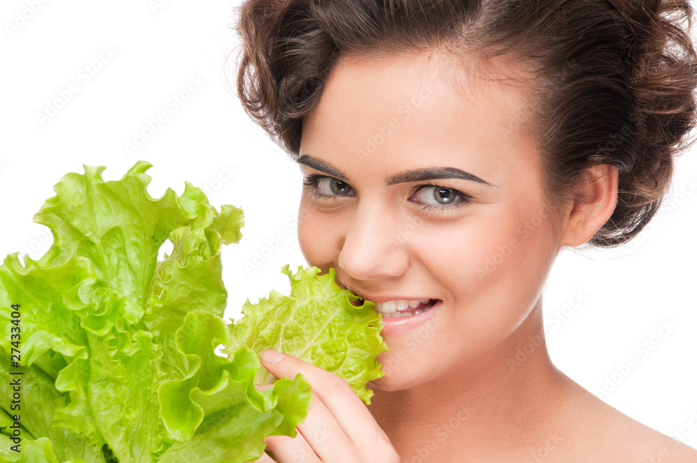 Closeup portrait of emotional beauty woman with green lettuce Closeup portrait of emotional beauty woman with green lettuce