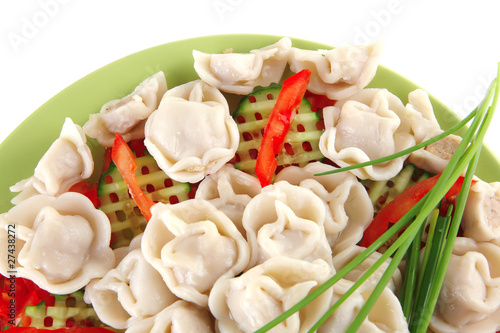 dumplings with peppers on green