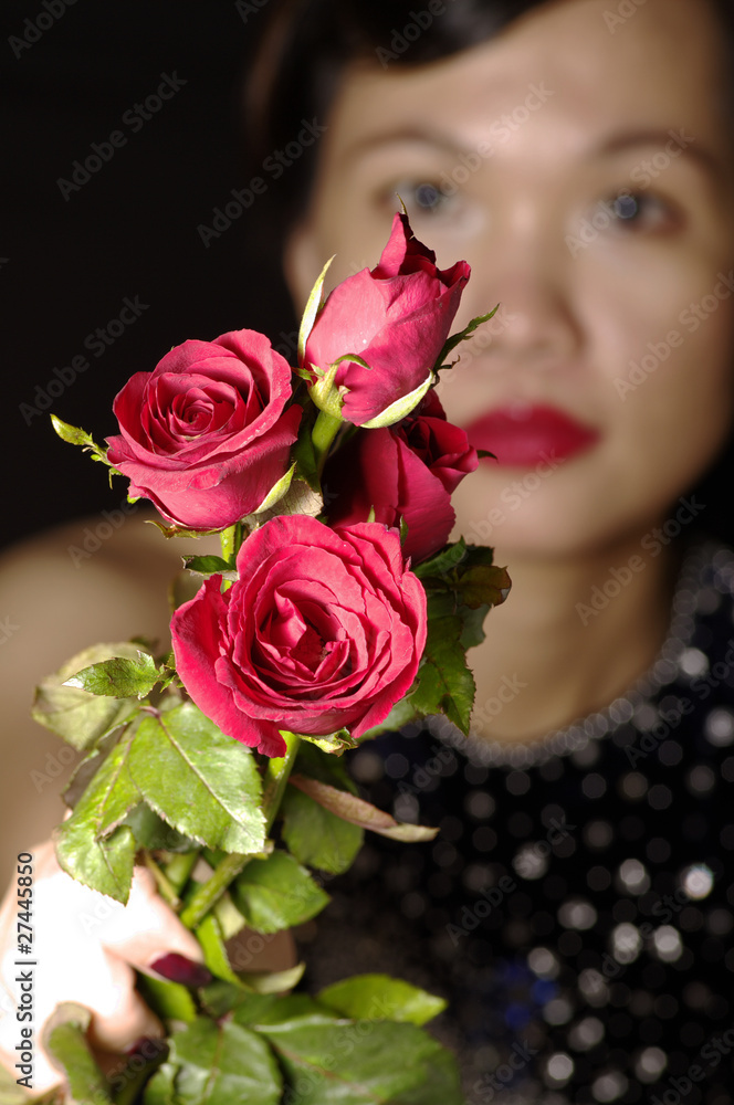 woman and red roses