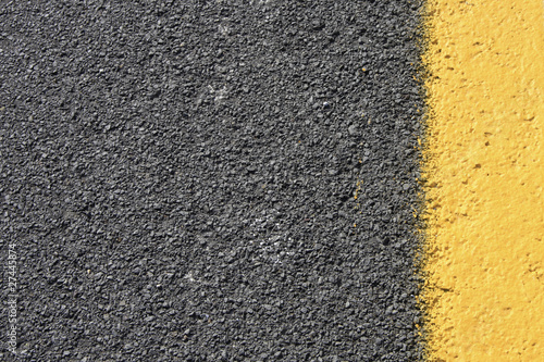 Dark grey with yellow asphalt road background