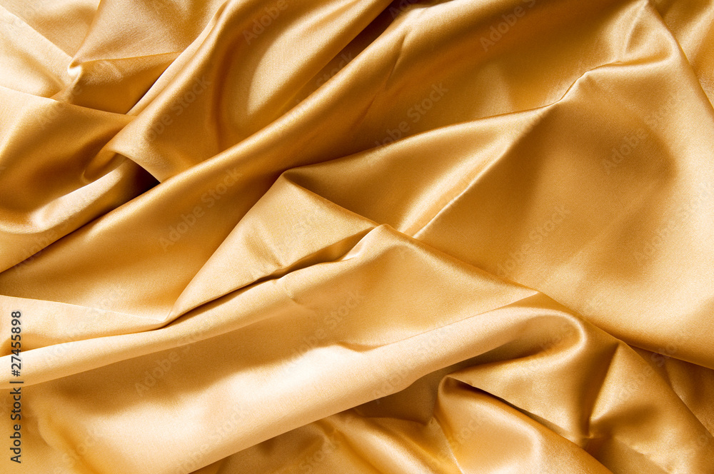 Bright satin fabric folded to be used as background Bright satin fabric folded to be used as background