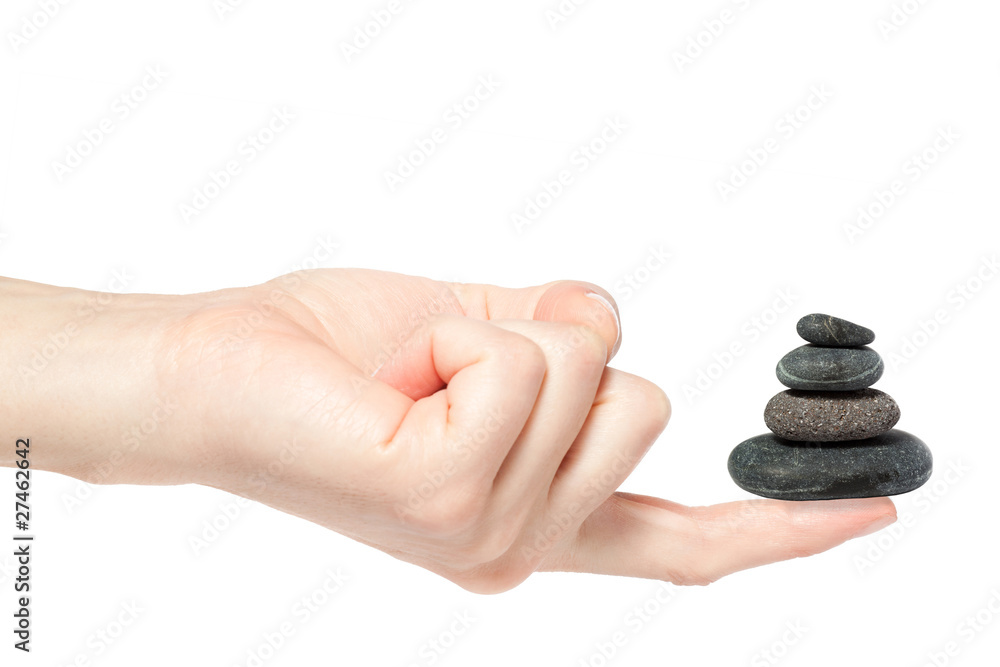 Female hand holding zen stones in perfect balance, Female hand holding zen stones in perfect balance,