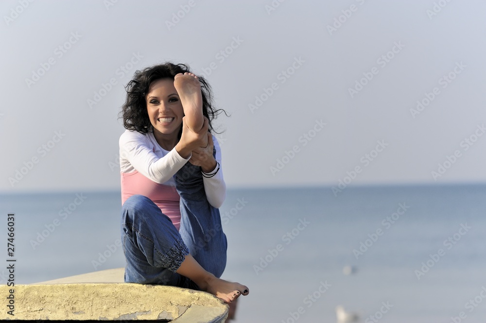 young girl in the summer time on an old fishing boat