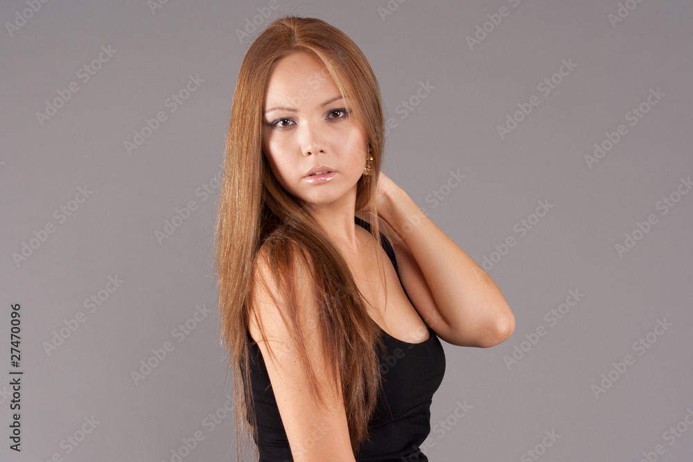 Fototapeta premium Asian model portrait wearing elegant dress with studio backgroun