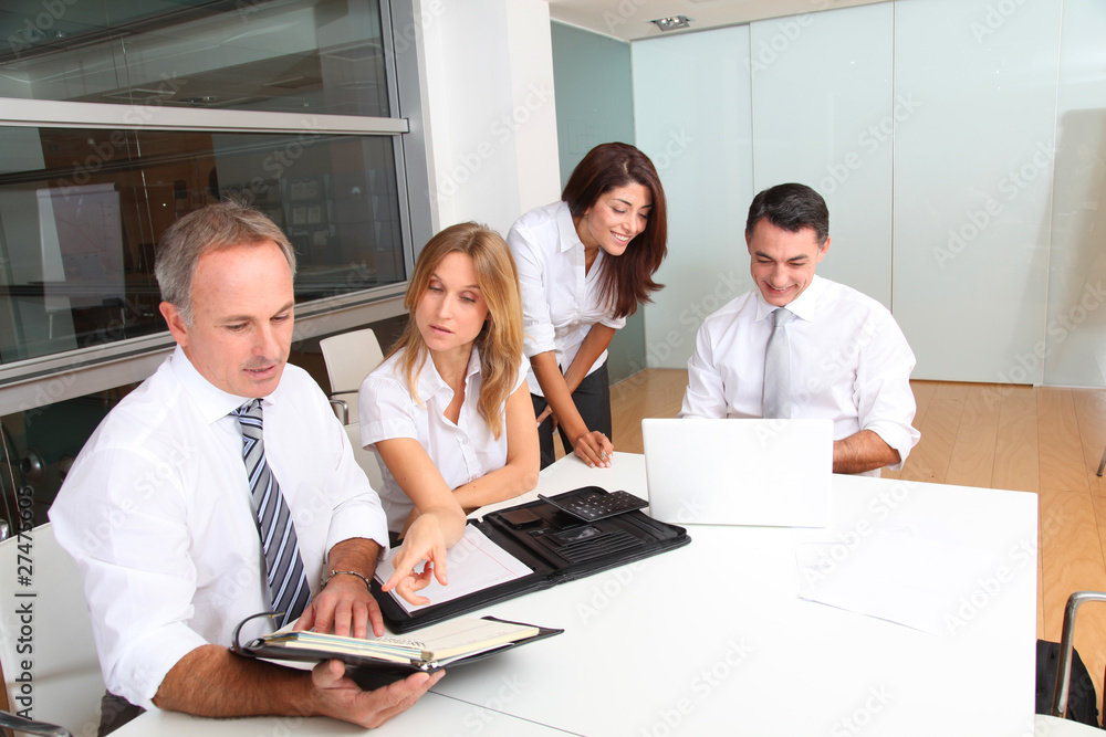 Business people meeting around table Business people meeting around table