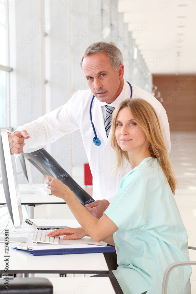 Doctor and nurse looking at x-ray Doctor and nurse looking at x-ray