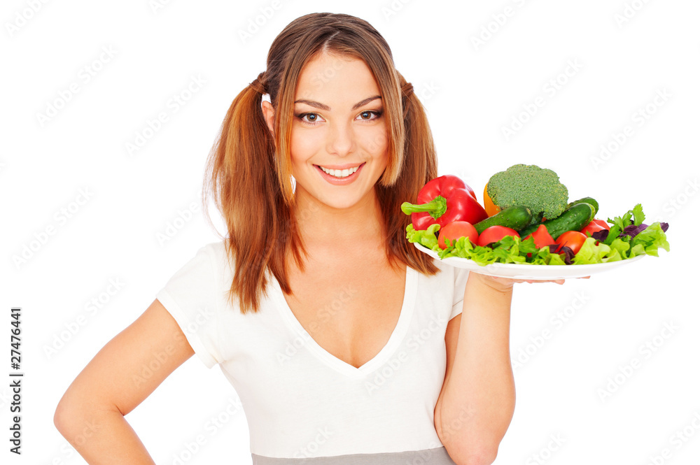 smiling young woman holding vegetables smiling young woman holding vegetables