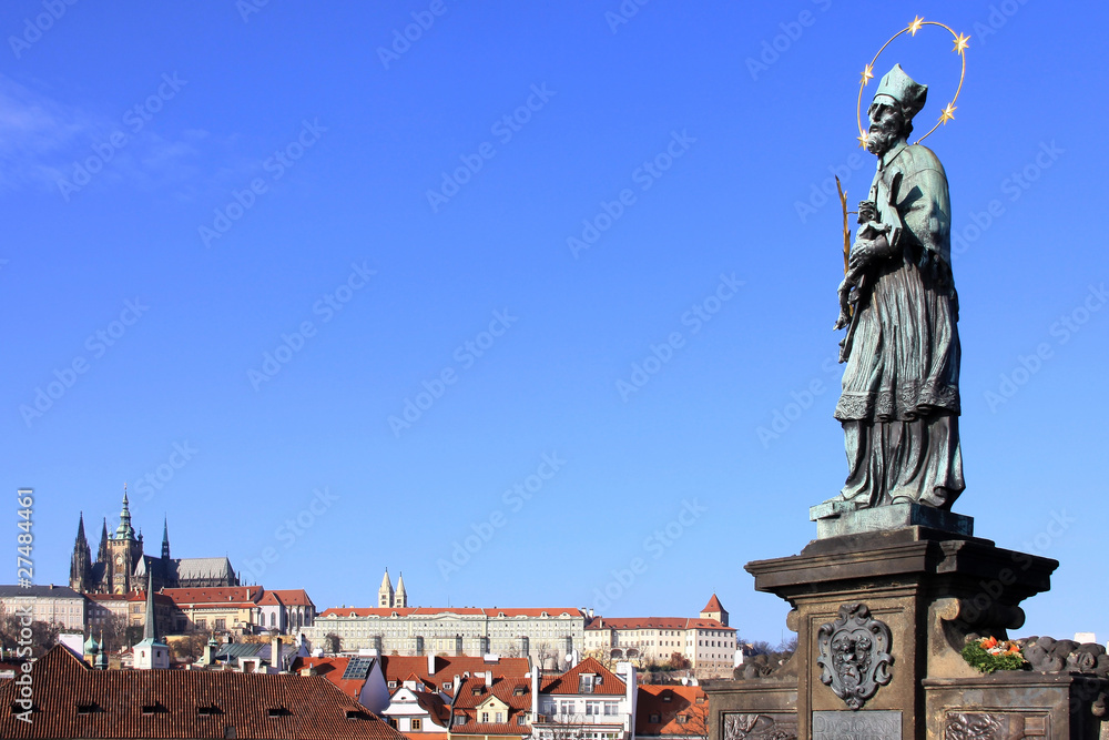 Baroque Statue on the Prague Charles Bridge with Castle