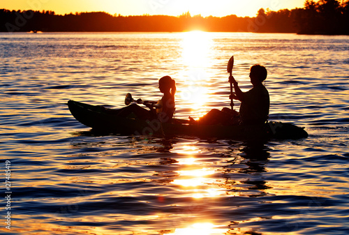 Silhouetted Kayakers