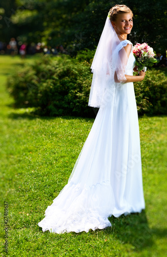 Young bride in park