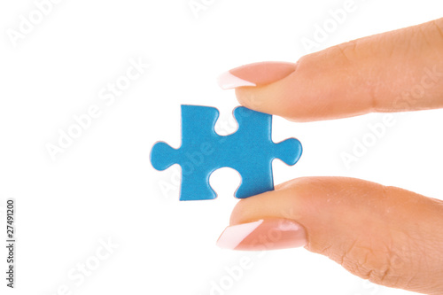 Hand with puzzle isolated on white