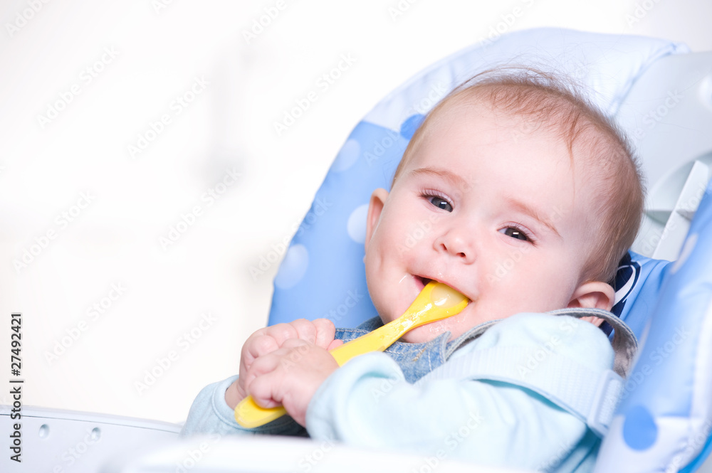 Happy baby with spoon Happy baby with spoon
