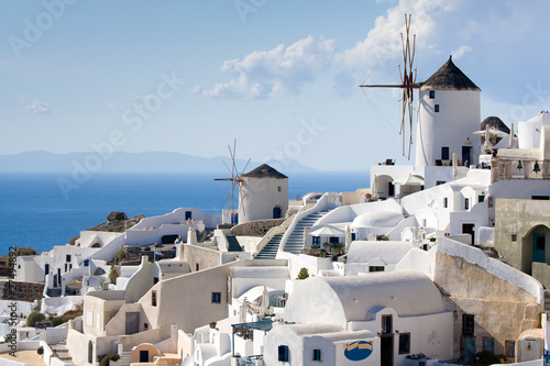 Traditional windmills in village Oia of Cyclades island Santorin