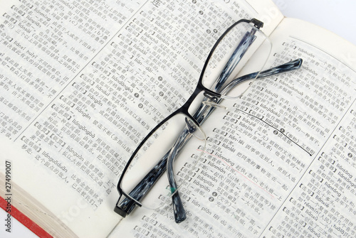 Eyeglasses and dictionary