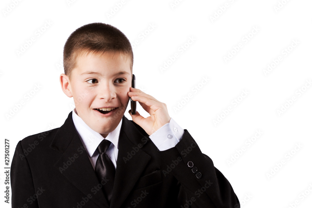 The boy speaks by phone, isolated on white The boy speaks by phone, isolated on white
