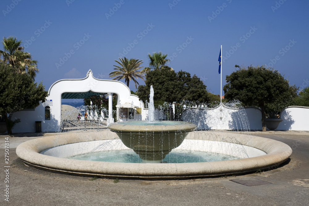 Fountain in front of entrance to the sea - Greece
