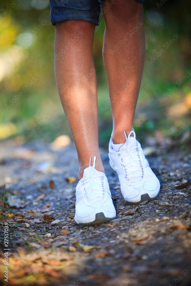 Woman walking cross country and trail Woman walking cross country and trail
