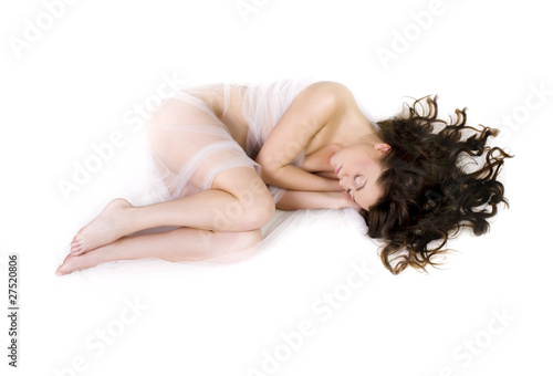 portrait of young beautiful woman sleeping on bed  photo
