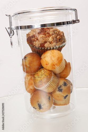 Muffins and cupcakes in airtight container photo