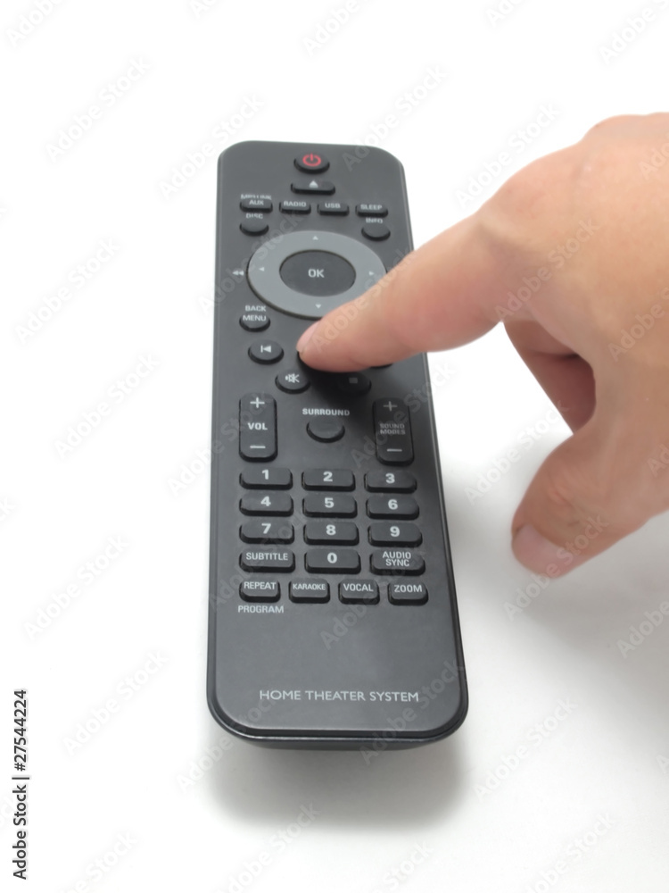 Finger holding a remote control with isolated on white Finger holding a remote control with isolated on white