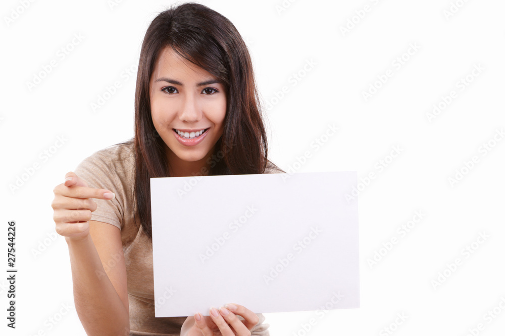 Young female pointing to blank card Young female pointing to blank card
