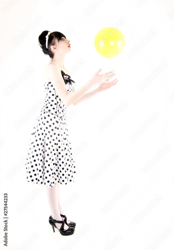 Portrait of a young girl posing with yellow ball Portrait of a young girl posing with yellow ball