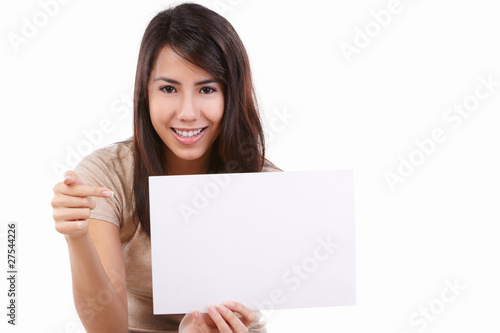 Young female pointing to blank card