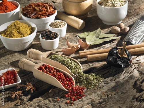 Various spices on a background of old wood