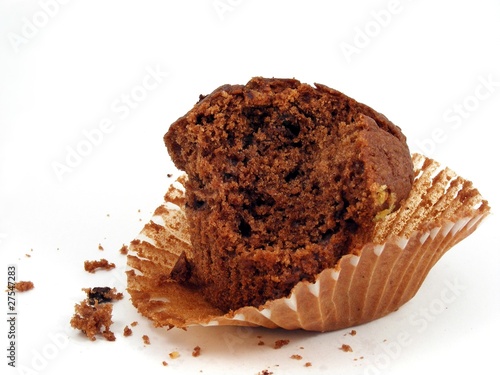Valokuva Chocolate muffin - half eaten on paper