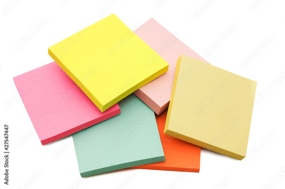 Block of vibrant multicoloured Post it Notes isolated on white Block of vibrant multicoloured Post it Notes isolated on white