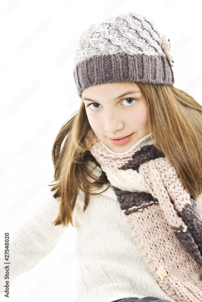 Smiling girl in winter style. Isolated on white