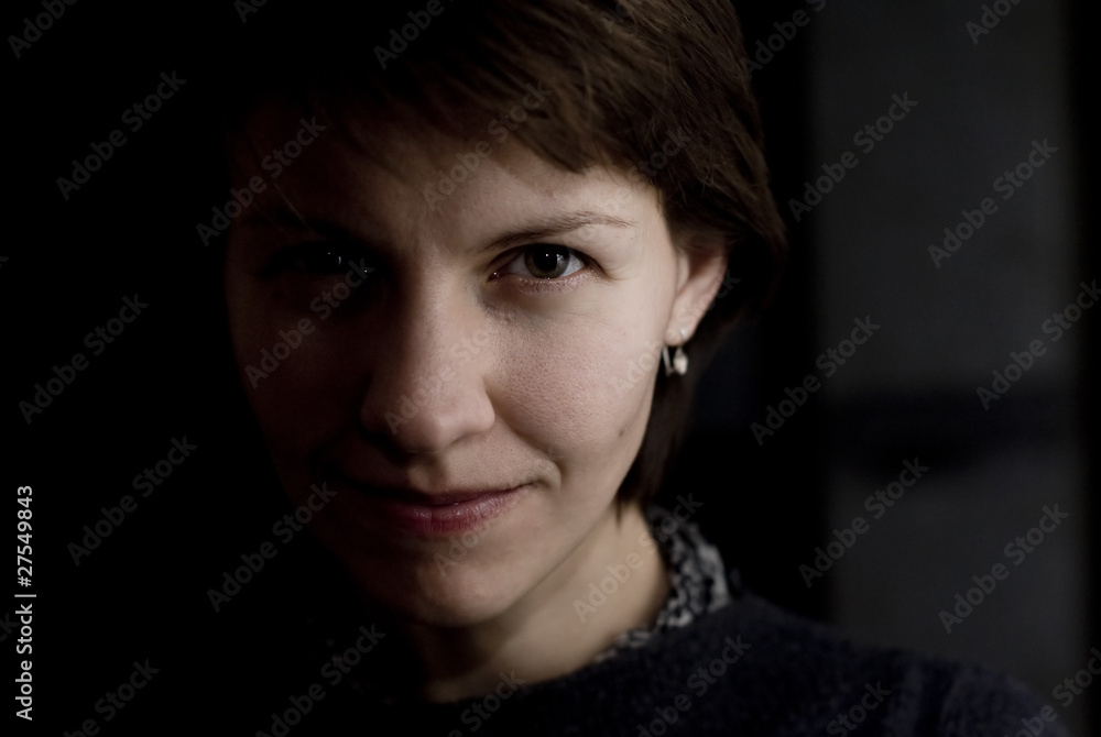 young woman's face half shadowed young woman's face half shadowed