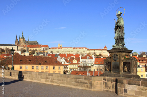 Baroque Statue on the Prague Charles Bridge with Castle