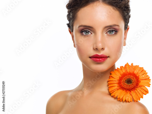 Beautiful woman face with a flower