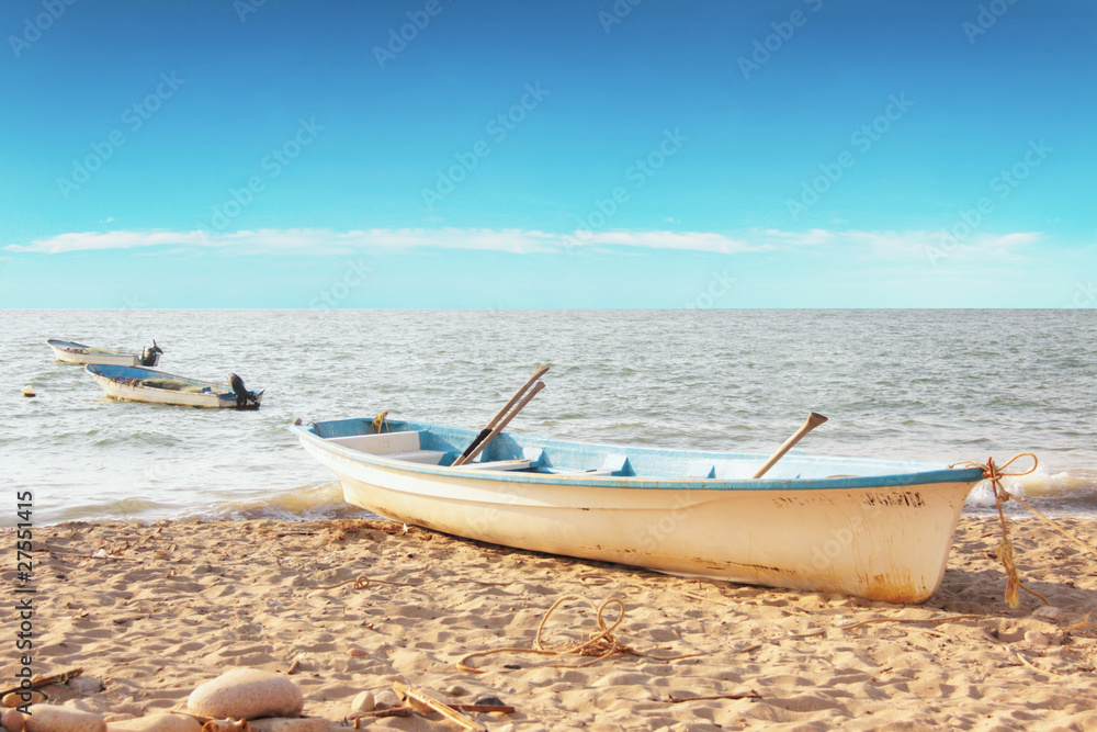 Landscape of empty fishing boats by the ocean Landscape of empty fishing boats by the ocean