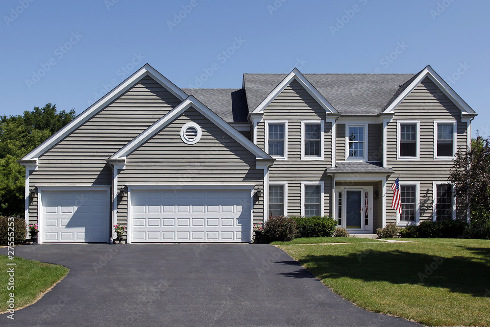 Home with gray siding and covered entry