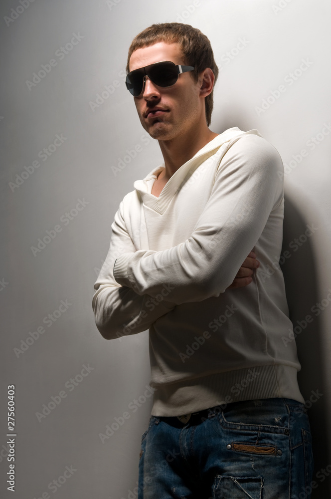 man standing near a wall man standing near a wall