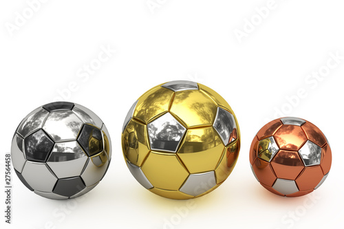 Golden  silver and bronze soccer balls on white