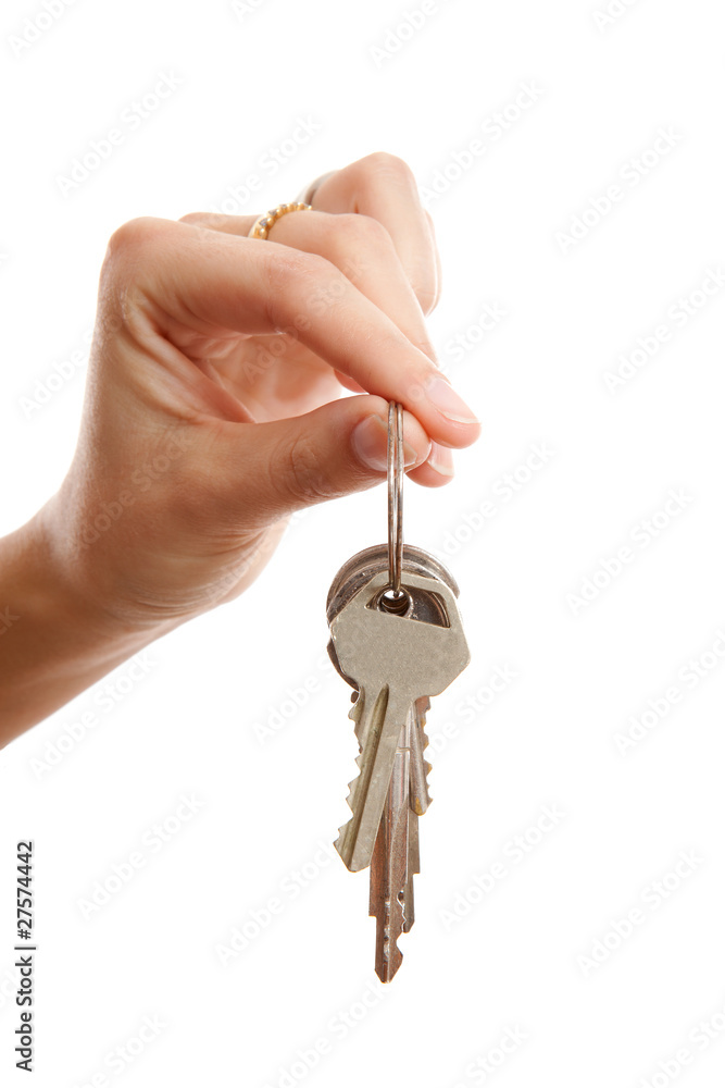 womans hand gives you the keys over white background
