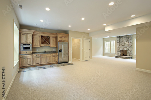 Basement with fireplace and bar