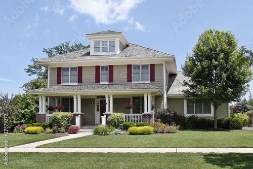Suburban home with red shutters