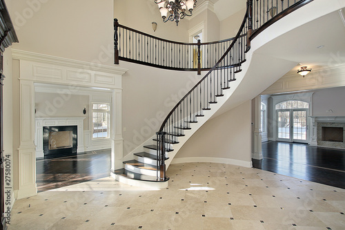 Foyer with spiral staircase photo