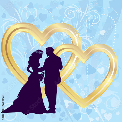 Silhouettes of bride and groom and two golden hearts